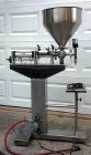Used Cleveland Equipment LGGZ-250 Semi Automatic Piston Filler. Has fill range: 1.5 ot 8.5 oz. Free standing unit with foot pedal operation. Positive shut off nozzle. Ideally suited for liquids, past...