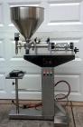 Used Cleveland Equipment LGGZ-250 Semi Automatic Piston Filler. Has fill range: 1.5 ot 8.5 oz. Free standing unit with foot pedal operation. Positive shut off nozzle. Ideally suited for liquids, past...