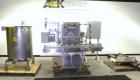 Used Filamatic (National Instruments) 10 Head In-Line Piston Filler, Model AL-800HS. No nozzles or centering bells, bottom up fill. (10) approximate 260cc pistons. Conveyor infeed and discharge. Incl...