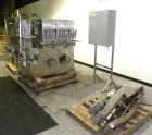 Used Filamatic (National Instruments) 10 Head In-Line Piston Filler, Model AL-800HS. No nozzles or centering bells, bottom up fill. (10) approximate 260cc pistons. Conveyor infeed and discharge. Incl...