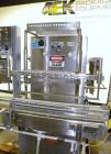 Used Filamatic (National Instruments) 10 Head In-Line Piston Filler, Model AL-800HS. No nozzles or centering bells, bottom up fill. (10) approximate 260cc pistons. Conveyor infeed and discharge. Incl...