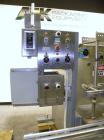 Used Filamatic (National Instruments) 10 Head In-Line Piston Filler, Model AL-800HS. No nozzles or centering bells, bottom up fill. (10) approximate 260cc pistons. Conveyor infeed and discharge. Incl...