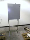 Used Filamatic (National Instruments) 10 Head In-Line Piston Filler, Model AL-800HS. No nozzles or centering bells, bottom up fill. (10) approximate 260cc pistons. Conveyor infeed and discharge. Incl...