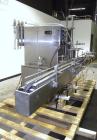 Used Filamatic Inline Piston Filler, Model CVK-300-1. Equipped with (8) 1000 cc pistons, all stainless steel. Automatic diving nozzle style, missing nozzles. Pneumatic container indexing. Self-contai...