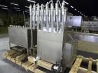 Used Filamatic Inline Piston Filler, Model CVK-300-1. Equipped with (8) 1000 cc pistons, all stainless steel. Automatic diving nozzle style, missing nozzles. Pneumatic container indexing. Self-contai...