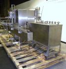 Used Filamatic Inline Piston Filler, Model CVK-300-1. Equipped with (8) 1000 cc pistons, all stainless steel. Automatic diving nozzle style, missing nozzles. Pneumatic container indexing. Self-contai...