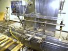 Used Filamatic Inline Piston Filler, Model CVK-300-1. Equipped with (8) 1000 cc pistons, all stainless steel. Automatic diving nozzle style, missing nozzles. Pneumatic container indexing. Self-contai...