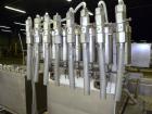 Used Filamatic Inline Piston Filler, Model CVK-300-1. Equipped with (8) 1000 cc pistons, all stainless steel. Automatic diving nozzle style, missing nozzles. Pneumatic container indexing. Self-contai...