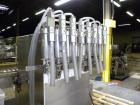 Used Filamatic Inline Piston Filler, Model CVK-300-1. Equipped with (8) 1000 cc pistons, all stainless steel. Automatic diving nozzle style, missing nozzles. Pneumatic container indexing. Self-contai...
