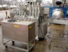 Used Filamatic Inline Piston Filler, Model CVK-300-1. Equipped with (8) 1000 cc pistons, all stainless steel. Automatic diving nozzle style, missing nozzles. Pneumatic container indexing. Self-contai...