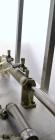 Used Hinds-Bock Single Piston Filler/Depositer, Model SP-64, Stainless Steel. Capable of speeds from 10 to 20 containers per minute (depending on fill size). Fill size range: 1/2 oz to 64 oz with cha...
