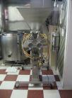 Used Hinds-Boch Twin Head Piston Filling Machine with hopper, on casters. Equipped withdual 32oz pistons, pneumatic foot pedal actuation.