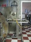 Used Hinds-Boch Twin Head Piston Filling Machine with hopper, on casters. Equipped withdual 32oz pistons, pneumatic foot pedal actuation.