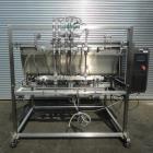 Unused- Inline Filling Systems 8 Head Pneumatic Activated Piston Filler with poppet valves. Model FP8. New 2010. The automatic piston filling system features adjustable piston/cylinder assembly to pr...