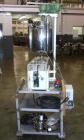 Used Kalix Single Head Piston Filler, Model 50MI, Stainless Steel. Single piston filling head, jacketed and agitated feed hopper, and foot pedal control. Mounted on a stand.