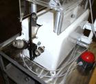 Used Kalix Single Head Piston Filler, Model 50MI, Stainless Steel. Single piston filling head, jacketed and agitated feed hopper, and foot pedal control. Mounted on a stand.