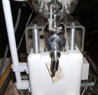 Used Kalix Single Head Piston Filler, Model 50MI, Stainless Steel. Single piston filling head, jacketed and agitated feed hopper, and foot pedal control. Mounted on a stand.