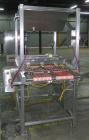 Used Quantum Model QTIA2000-12 Dual Lane Sauce Applicator. Twin piston design is rated at up to 120 pies per minute.  Machine has Allen Bradley controls.  Has continuous motion conveyors, sanitary de...