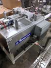Used Simplex Model AS200 Twin Piston Filler and Accumulation Tables.