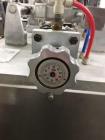Used Simplex Model AS200 Twin Piston Filler and Accumulation Tables.