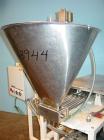 Used Simplex 4 Head Filler. Stainless steel nozzles 2