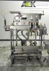Used Thiele Model AF-2T-B1 Two Head PD Filler. Filler is designed to fill Quart to Gallon containers, (actual range 4 oz min to 185 oz maximum) at rates of 30-400 quart/min & 20-30 gallon/min. Each f...
