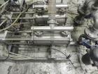 Used Thiele Model AF-2T-B1 Two Head PD Filler. Filler is designed to fill Quart to Gallon containers, (actual range 4 oz min to 185 oz maximum) at rates of 30-400 quart/min & 20-30 gallon/min. Each f...