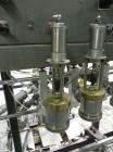 Used Thiele Model AF-3T-B1 Three Head PD Filler. Filler is designed to fill Quart to Gallon containers, (actual range 4 oz min to 185 oz maximum) at rates of 45 - 60 quart/min & 30-45 gallon/min. Eac...
