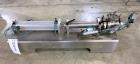 Used Wenzhou Rigao Table Top Semi Automatic Piston Filler, Model DYF. 316L Stainless steel product contact. Filling speed 5 to 20 bottles per minute. Filling accuracy /= 1% +/-. Filling range: approx...