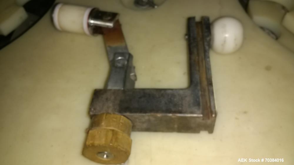 Used MRM 30 Piston Filler. Last running pie dough in a can. 2" piston with 7" stroke - 12oz capacity. Infeed screw with infeed/discharge star. 4.75" centers. No container no fill , electric fill adju...