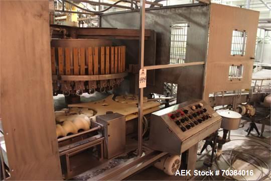 Used MRM 30 Piston Filler. Last running pie dough in a can. 2" piston with 7" stroke - 12oz capacity. Infeed screw with infeed/discharge star. 4.75" centers. No container no fill , electric fill adju...