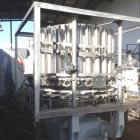 Used Pfaudler 28 Head Rotary Piston Filler.
