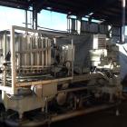 Used Pfaudler 28 Head Rotary Piston Filler.