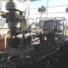 Used Pfaudler 28 Head Rotary Piston Filler.