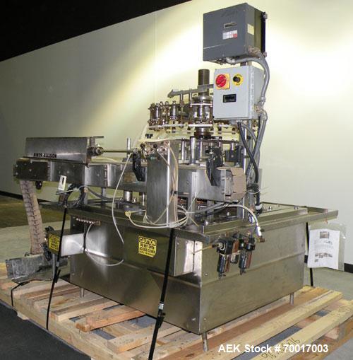 Used Biner Ellison Versamatic 12 Head Rotary Liquid Positive Displacement Filler, Model V 26-12. (12) 1/2" diameter nozzles on approximately 7" centers. Worm screw to starwheel infeed; left to right ...