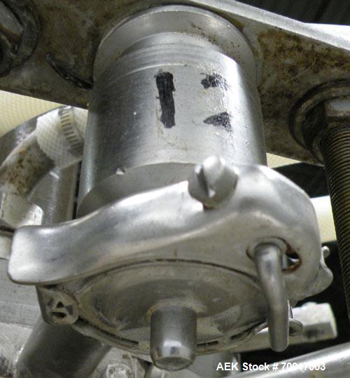 Used Biner Ellison Versamatic 12 Head Rotary Liquid Positive Displacement Filler, Model V 26-12. (12) 1/2" diameter nozzles on approximately 7" centers. Worm screw to starwheel infeed; left to right ...