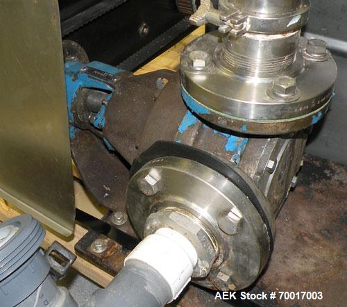 Used Biner Ellison Versamatic 12 Head Rotary Liquid Positive Displacement Filler, Model V 26-12. (12) 1/2" diameter nozzles on approximately 7" centers. Worm screw to starwheel infeed; left to right ...