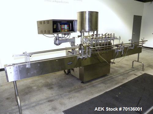 Used Kalish Kalishtronic Model KT12 Positive Displacement Filler. Currentlyt set up with 8 pumps and filling nozzles. Has neck guides, positive shut off nozzles, pin indexing and table top chain conv...