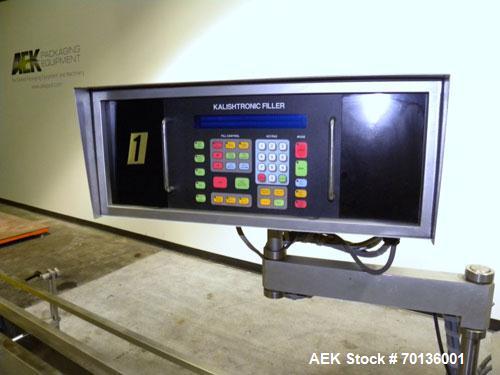 Used Kalish Kalishtronic Model KT12 Positive Displacement Filler. Currentlyt set up with 8 pumps and filling nozzles. Has neck guides, positive shut off nozzles, pin indexing and table top chain conv...