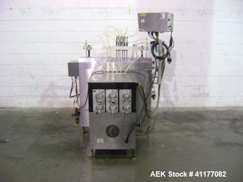 Used Kalish 6 Head Positive Displacement Filler, Model KT-6. Positive shut off valves. Last filling 1 oz and 2 oz containers. Currently set up with 12 liter per minute pumps. Has 10' long x 4-1/2" wi...