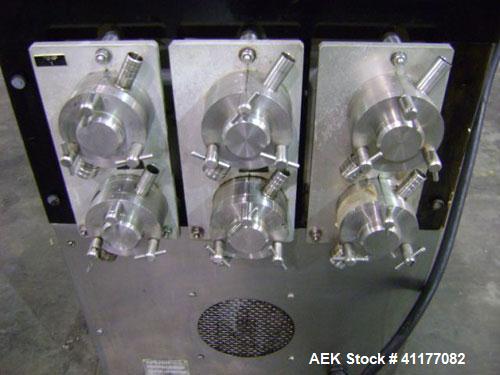 Used Kalish 6 Head Positive Displacement Filler, Model KT-6. Positive shut off valves. Last filling 1 oz and 2 oz containers. Currently set up with 12 liter per minute pumps. Has 10' long x 4-1/2" wi...