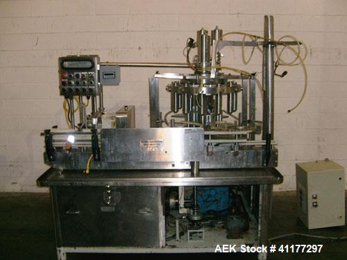 Used Pacific Packaging Machinery 12 Head Rotary Positive Displacement Filler. Capable of speeds up to 160 cpm. Has (12) 3/4" diameter nozzles on 6" centers. Rising pedestals for a bottom up fill. Has...