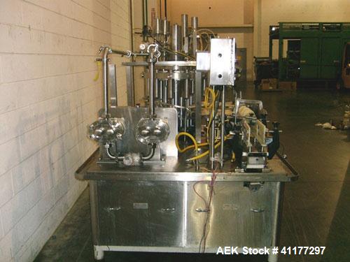 Used Pacific Packaging Machinery 12 Head Rotary Positive Displacement Filler. Capable of speeds up to 160 cpm. Has (12) 3/4" diameter nozzles on 6" centers. Rising pedestals for a bottom up fill. Has...