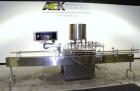 Used Kalish Kalishtronic Model KT12 Positive Displacement Filler. Currentlyt set up with 8 pumps and filling nozzles. Has neck guides, positive shut off nozzles, pin indexing and table top chain conv...