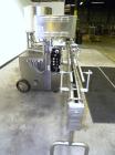 Used Kalish Kalishtronic Model KT12 Positive Displacement Filler. Currentlyt set up with 8 pumps and filling nozzles. Has neck guides, positive shut off nozzles, pin indexing and table top chain conv...