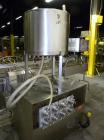 Used Kalish Kalishtronic Model KT12 Positive Displacement Filler. Currentlyt set up with 8 pumps and filling nozzles. Has neck guides, positive shut off nozzles, pin indexing and table top chain conv...
