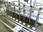 Used Kalish Kalishtronic Model KT12 Positive Displacement Filler. Currentlyt set up with 8 pumps and filling nozzles. Has neck guides, positive shut off nozzles, pin indexing and table top chain conv...