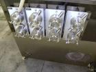 Used Kalish Kalishtronic Model KT12 Positive Displacement Filler. Currentlyt set up with 8 pumps and filling nozzles. Has neck guides, positive shut off nozzles, pin indexing and table top chain conv...