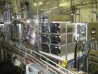 Used Oden Profil 1000 6-Head Inline Volumetric Filler. This unit features six (6) Waukesha Model 15 universal pumps and is currently set up with 1 inch diameter positive shut off nozzles. Pin Indexin...
