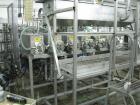 Used Oden Profil 1000 6-Head Inline Volumetric Filler. This unit features six (6) Waukesha Model 15 universal pumps and is currently set up with 1 inch diameter positive shut off nozzles. Pin Indexin...